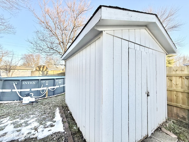 view of outdoor structure with a fenced in pool