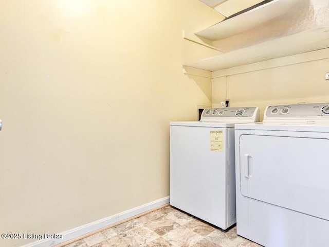 clothes washing area featuring separate washer and dryer