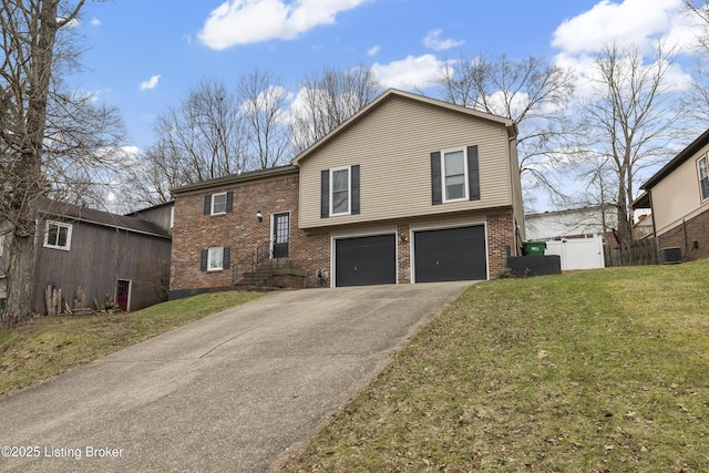 view of front of home featuring a garage and a front lawn