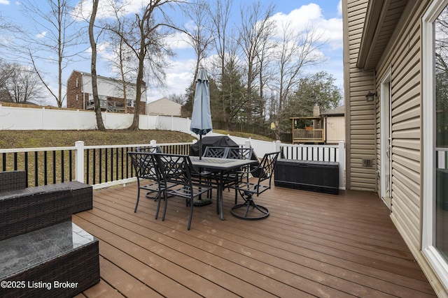 deck featuring a lawn