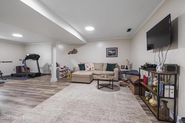 living room featuring ornamental molding and hardwood / wood-style floors