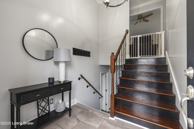 staircase with ceiling fan