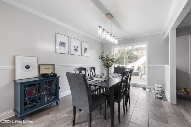 dining room featuring ornamental molding