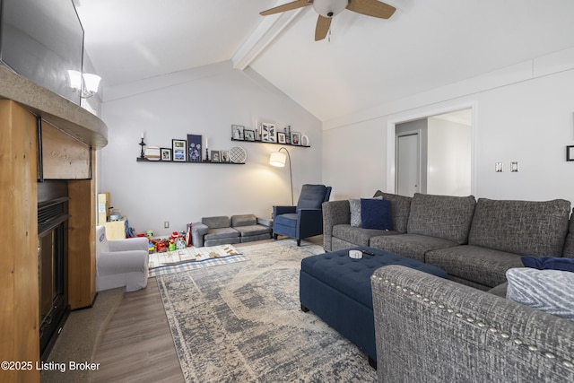 living room with wood-type flooring, lofted ceiling with beams, and ceiling fan