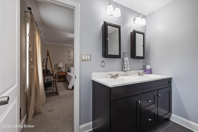 bathroom featuring ornamental molding and vanity