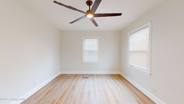 empty room featuring ceiling fan and light wood-type flooring