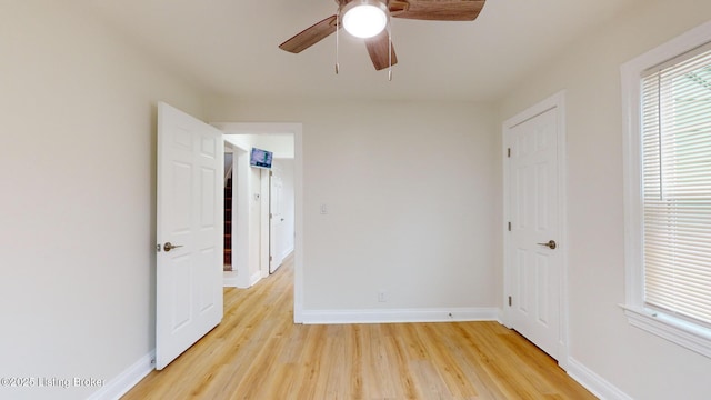 unfurnished room featuring light hardwood / wood-style flooring and ceiling fan