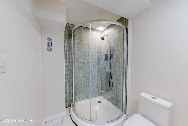 bathroom with walk in shower and toilet