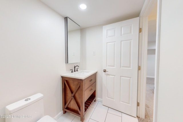 bathroom with tile patterned floors, vanity, and toilet