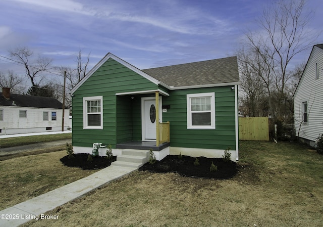 bungalow featuring a front yard