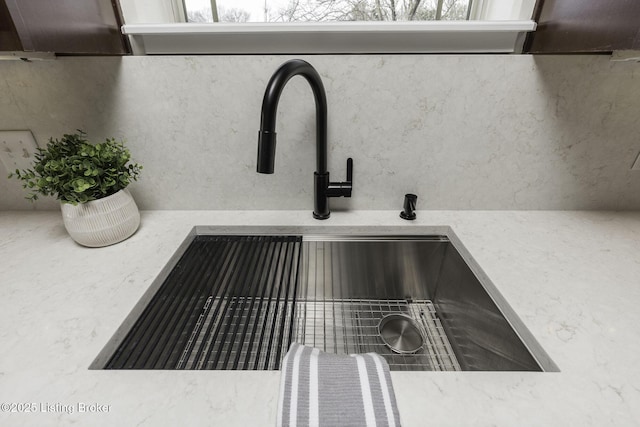 room details featuring a sink and light countertops