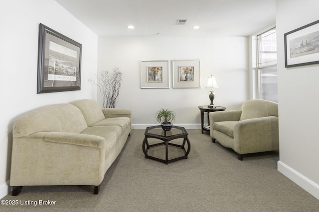 living area with visible vents, recessed lighting, baseboards, and carpet