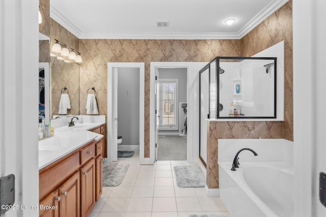 full bath with a stall shower, ornamental molding, a garden tub, and a sink