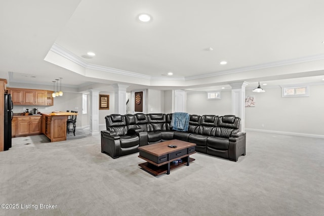 living room featuring recessed lighting, decorative columns, baseboards, and light colored carpet