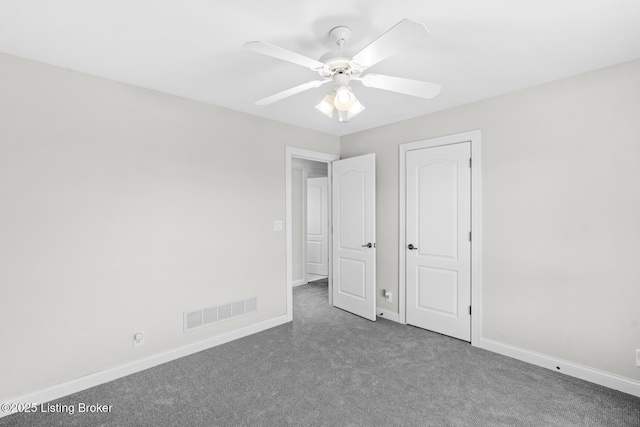 unfurnished bedroom featuring a ceiling fan, carpet, visible vents, and baseboards