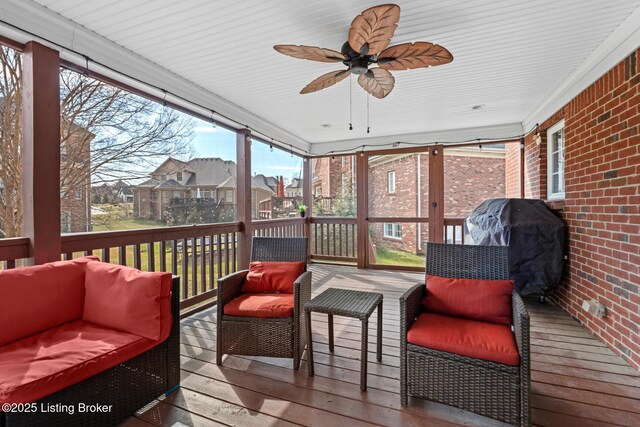 exterior space with area for grilling, an outdoor living space, and a ceiling fan