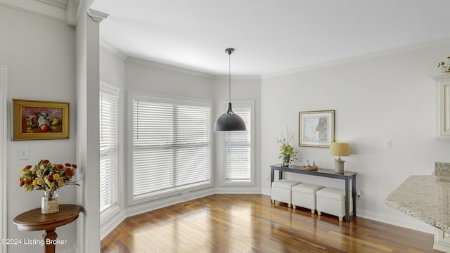 dining area featuring crown molding and dark hardwood / wood-style flooring