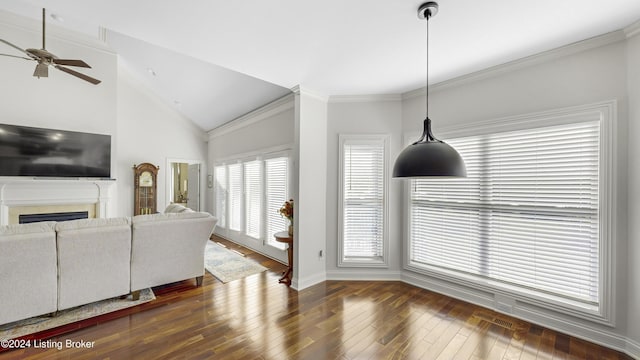 interior space featuring crown molding, vaulted ceiling, dark hardwood / wood-style floors, and ceiling fan