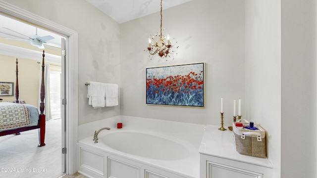 bathroom featuring ceiling fan with notable chandelier and a tub to relax in