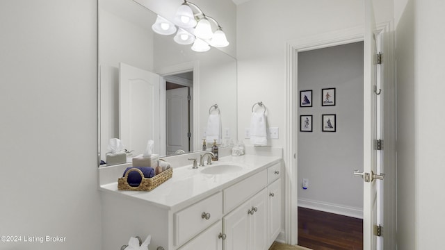 bathroom featuring vanity and hardwood / wood-style floors