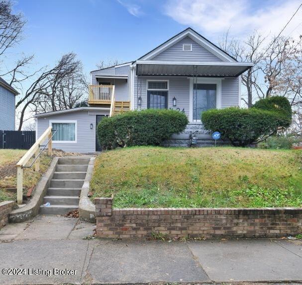 bungalow-style house featuring a front yard and a porch