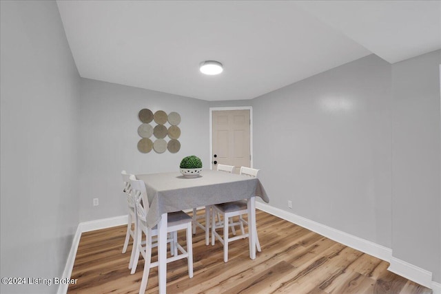 dining area with hardwood / wood-style flooring