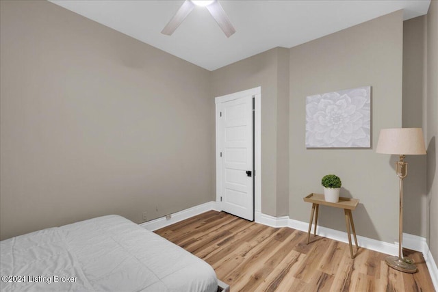 bedroom featuring hardwood / wood-style flooring and ceiling fan