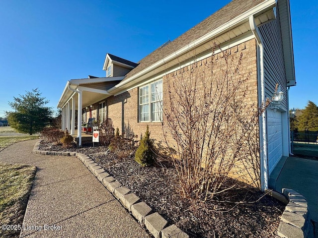 view of property exterior featuring a porch