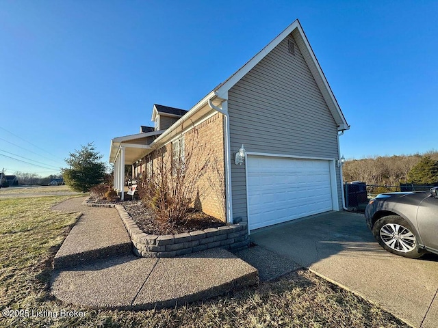 view of side of home featuring a garage