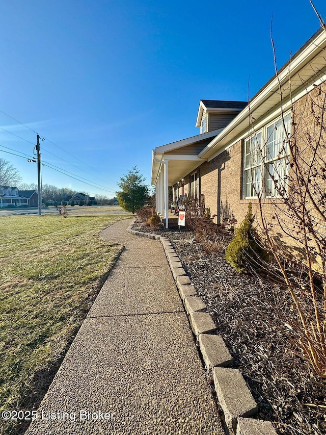 view of home's exterior featuring a lawn