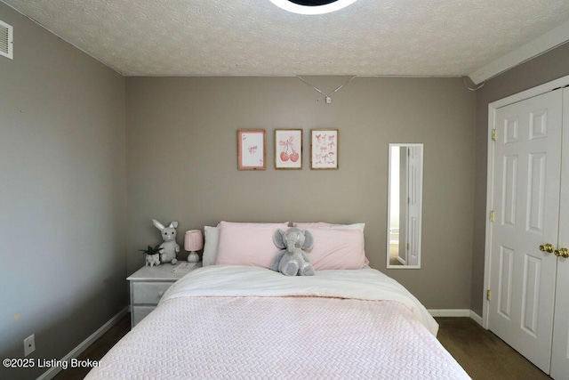 bedroom featuring a textured ceiling