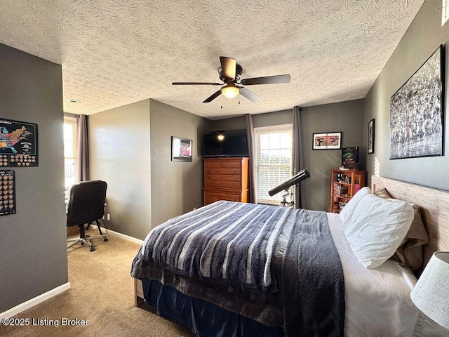 carpeted bedroom with a textured ceiling and ceiling fan