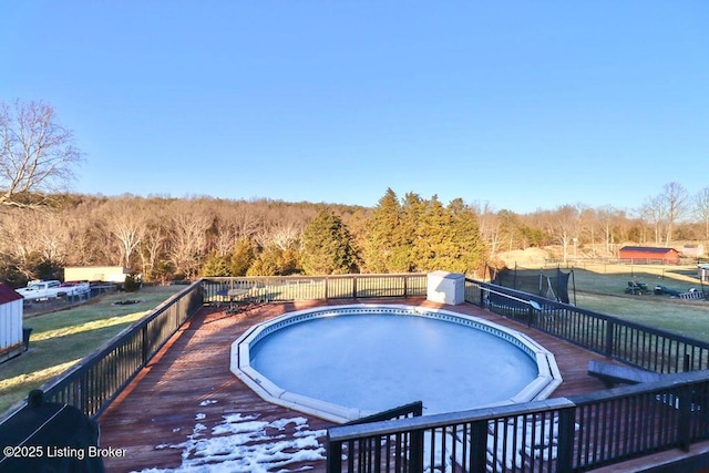 view of swimming pool featuring a deck