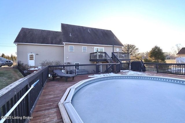 view of swimming pool with a deck