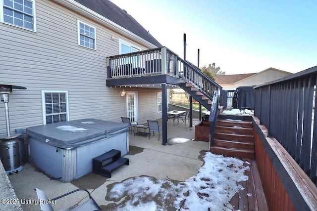 exterior space with a hot tub and a patio area