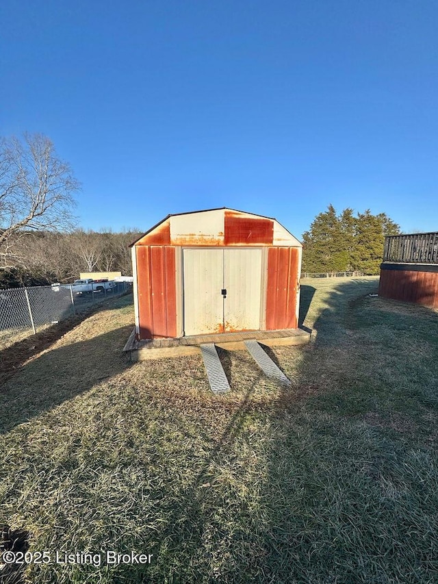 view of outbuilding featuring a lawn