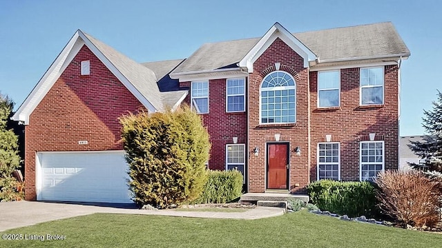 view of front of property featuring a garage and a front yard