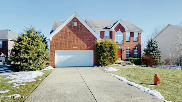 view of front of property featuring a garage and a front yard