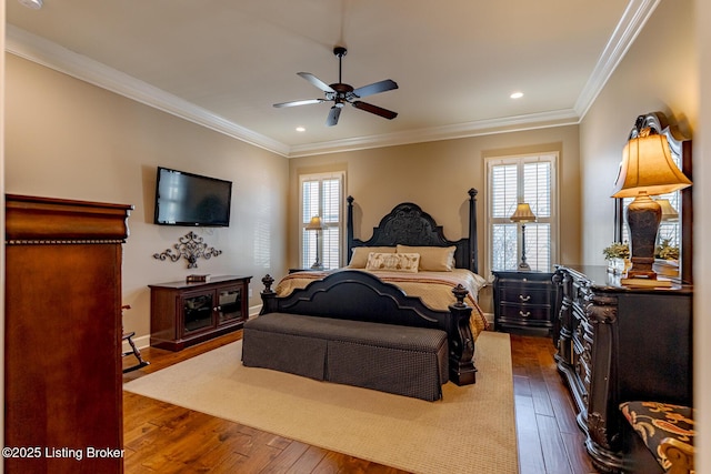 bedroom featuring ceiling fan, ornamental molding, and dark hardwood / wood-style floors