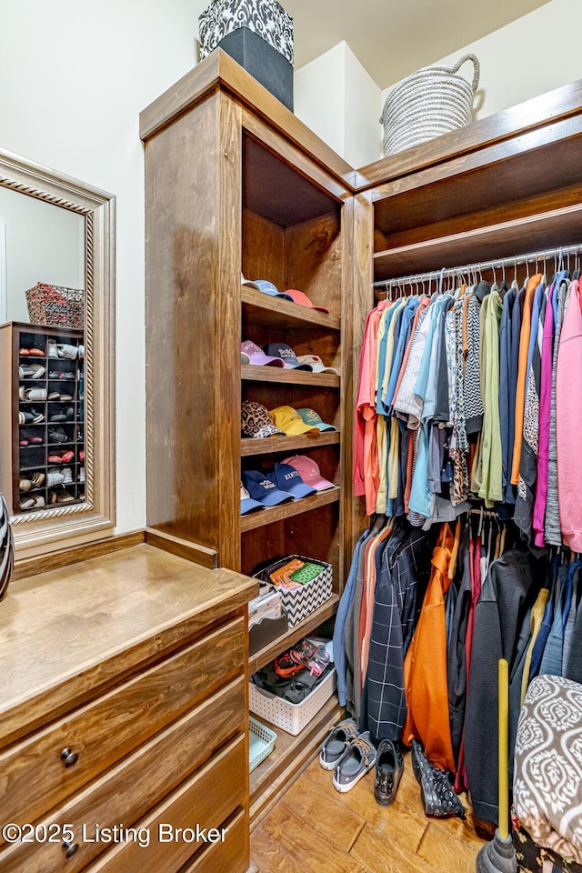 spacious closet featuring hardwood / wood-style flooring