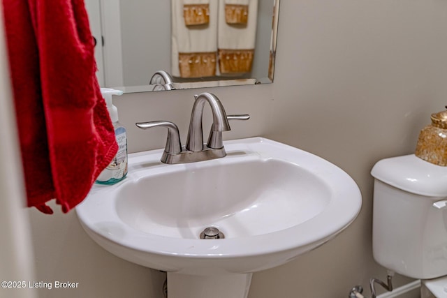 bathroom featuring sink and toilet