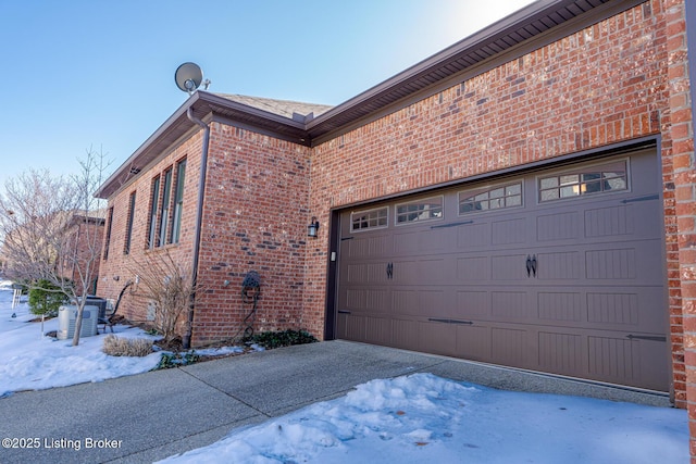 exterior space with cooling unit and a garage