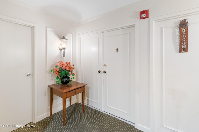 foyer entrance featuring ornamental molding