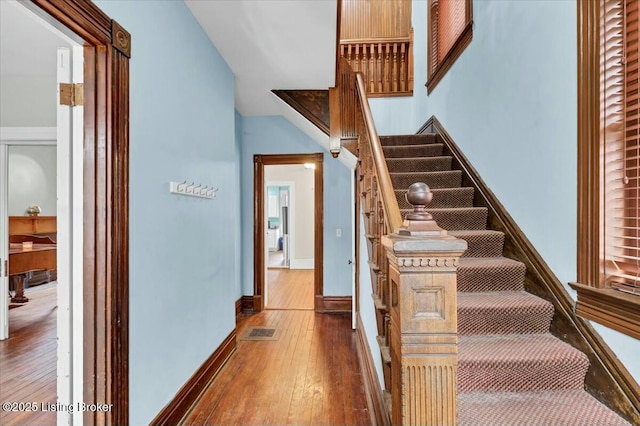 stairway featuring hardwood / wood-style floors