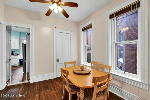 dining room featuring ceiling fan and dark hardwood / wood-style floors