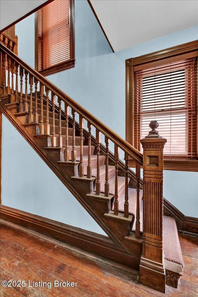 stairs with hardwood / wood-style flooring