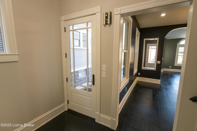 doorway to outside with dark wood-type flooring