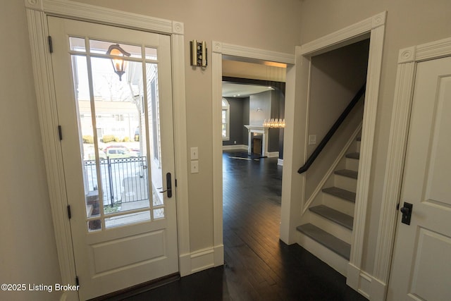 entryway with dark hardwood / wood-style floors