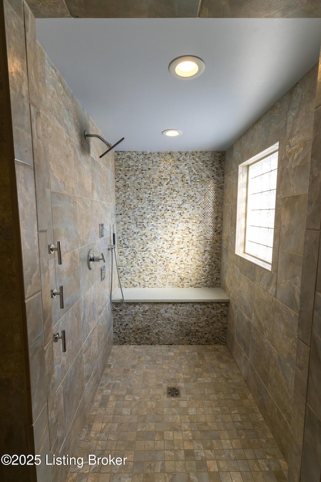 bathroom featuring a tile shower