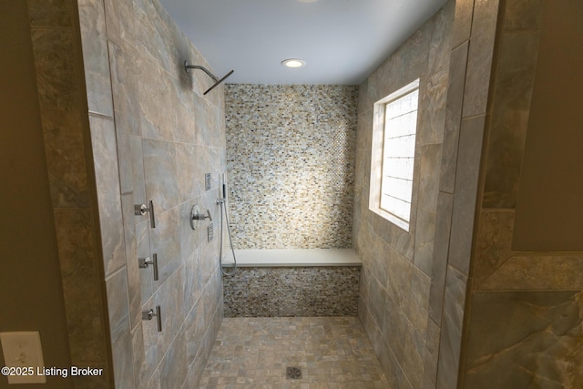 bathroom featuring tiled shower